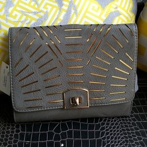 Grey lasercut clutch with gold accents